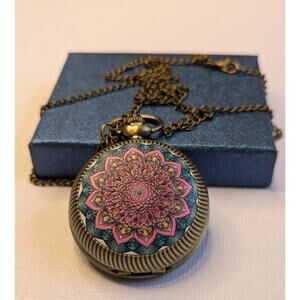 Strata Pocket Watch Rotating Flower Motif with Chain In Box Gold Tone Case NEW